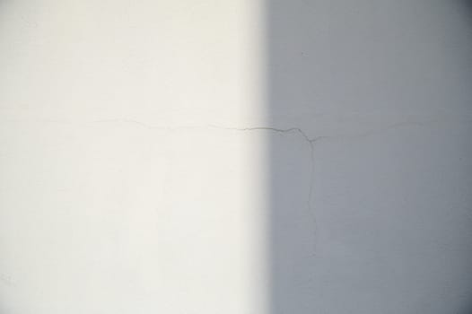 light plastered wall with a crack 2