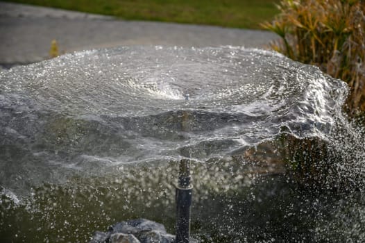 circle of water from a fountain spraying water