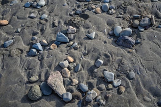 sea ​​pebbles on the sand of the beach 4