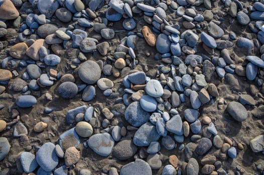 sea ​​pebbles on the sand of the beach