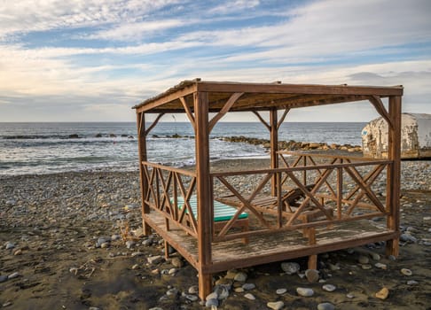 beach gazebo with sun loungers on the Mediterranean beach