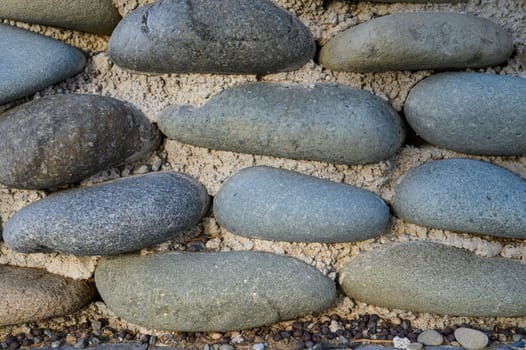 sea ​​pebbles with concrete as background 1