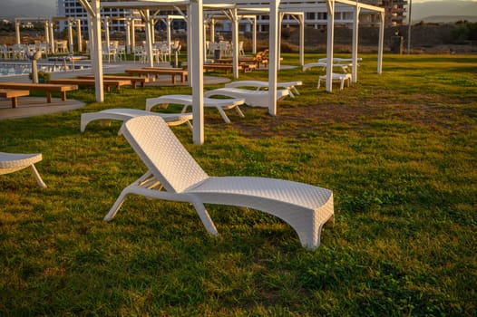 white plastic sun loungers on the Mediterranean sea 5