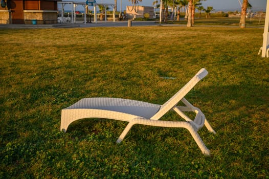 white plastic sun loungers on the Mediterranean sea 3