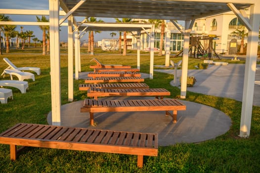 wooden sun loungers on the Mediterranean sea