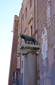 Ancient roman bronze statue of a she-wolf feeding Romulus and Remus the founders of the city and empire of Rome, Italy