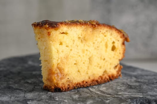 piece of pie with orange jam on a stone kitchen surface