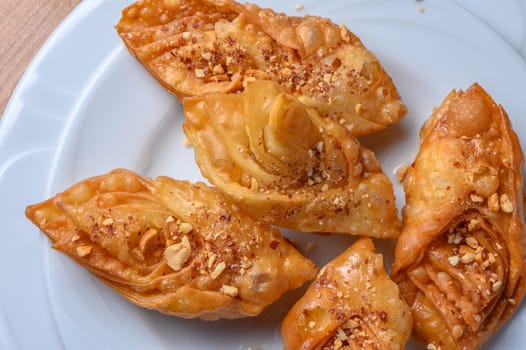 Turkish baklava, sweet dessert with honey on a light plate 16