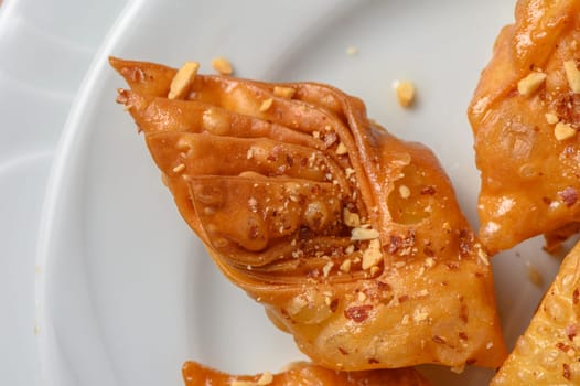 Turkish baklava, sweet dessert with honey on a light plate 19