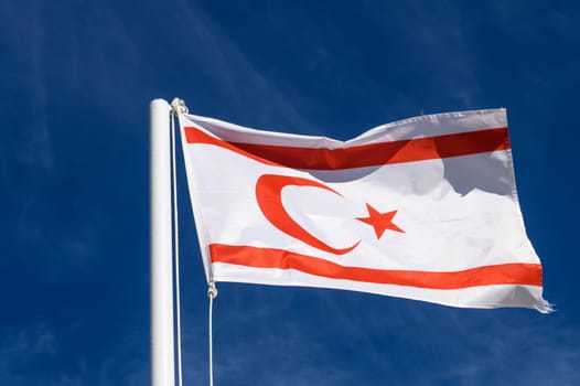 flag of the Turkish Republic of Northern Cyprus against a blue sky 5