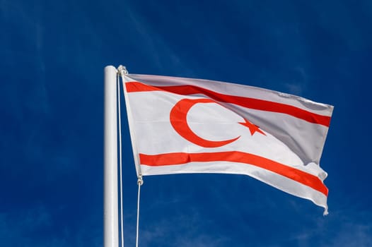 flag of the Turkish Republic of Northern Cyprus against a blue sky 6