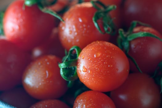 red fresh cherry tomatoes as food background 1