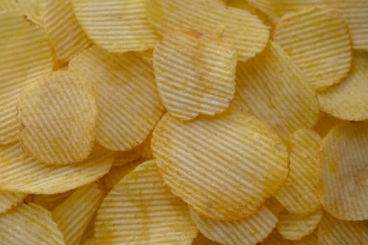 food background from delicious chips poured out of a pack 4