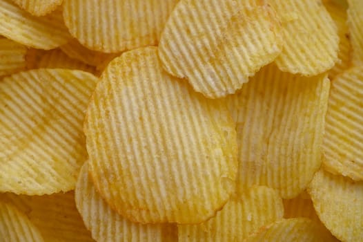 food background from delicious chips poured out of a pack 2