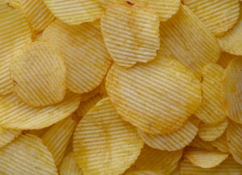 food background from delicious chips poured out of a pack 1