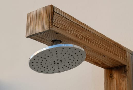 shower head near the pool on the street in a residential complex