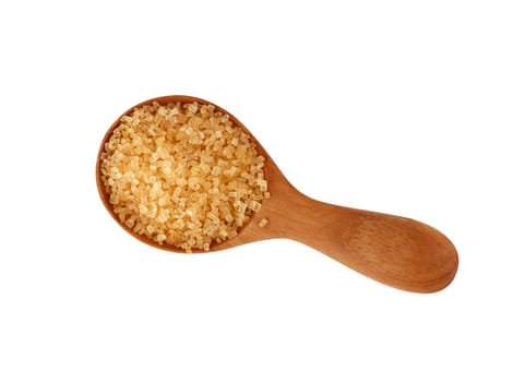Close up one wooden scoop spoon of brown cane sugar isolated on white background, top view