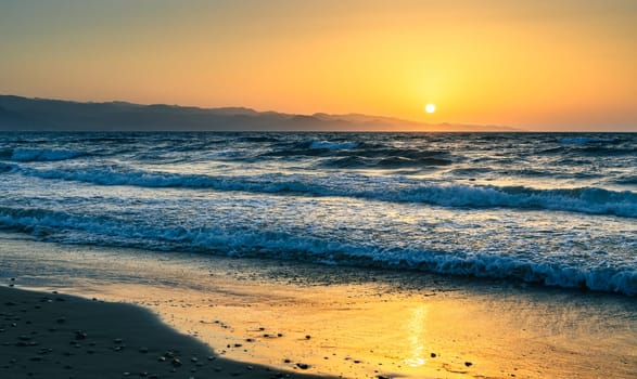 sunset on the Mediterranean sea and waves in autumn 1