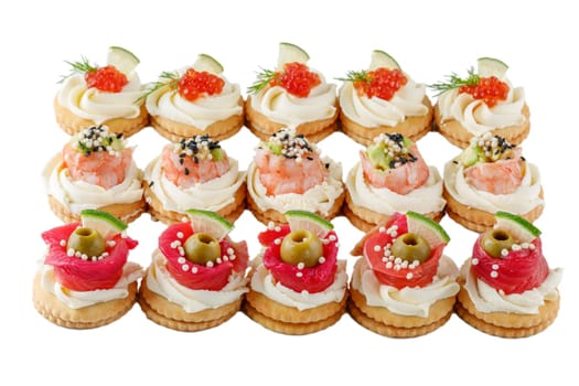 set of appetizing canapes with shrimp, avocado and smoked salmon on a white background for a food delivery site