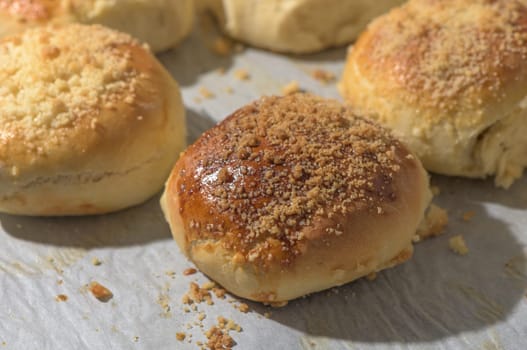 homemade bread rolls on parchment on a baking sheet 3