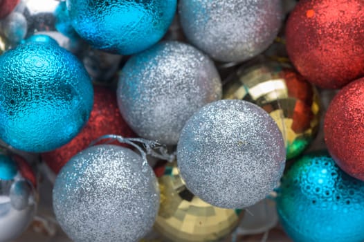 multi-colored Christmas tree decorations as a background