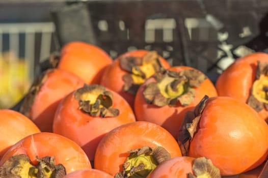 juicy persimmon in a box near the store 1