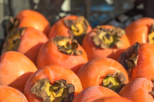 juicy persimmon in a box near the store