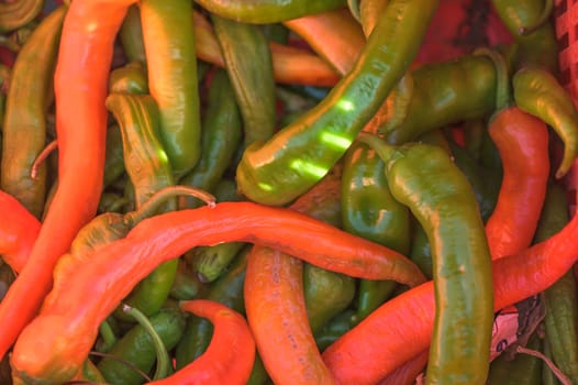 red and green peppers in a box near the store