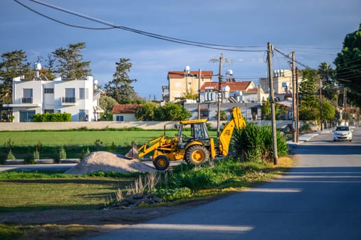 Gaziveren Cyprus 04/01/2024 - yellow tractor standing on the street 1