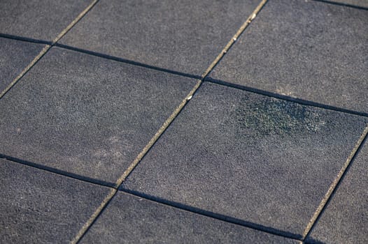 rubber soft covering with squares on the playground 10