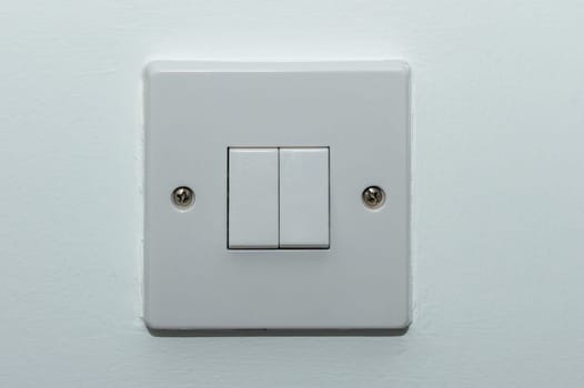 two button switch on a white wall