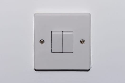 two button switch on a white wall 1