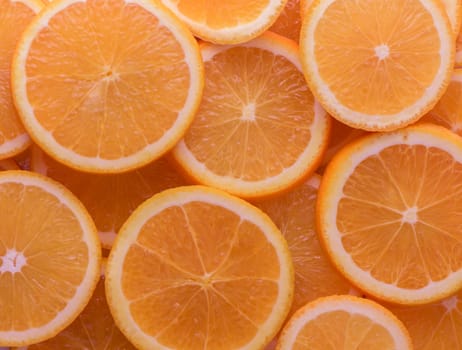 oranges cut into slices and laid out on the table as a food background 3