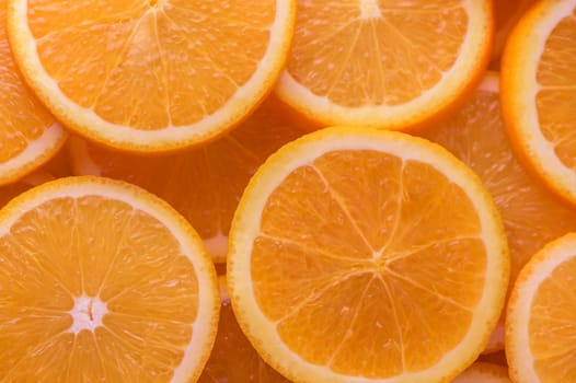 oranges cut into slices and laid out on the table as a food background 10