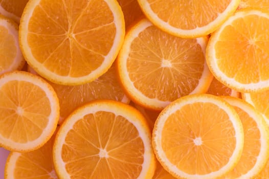 oranges cut into slices and laid out on the table as a food background 9