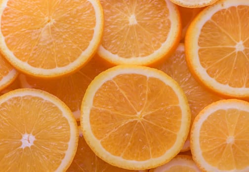 oranges cut into slices and laid out on the table as a food background 1