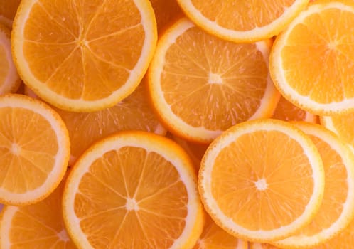 oranges cut into slices and laid out on the table as a food background 8