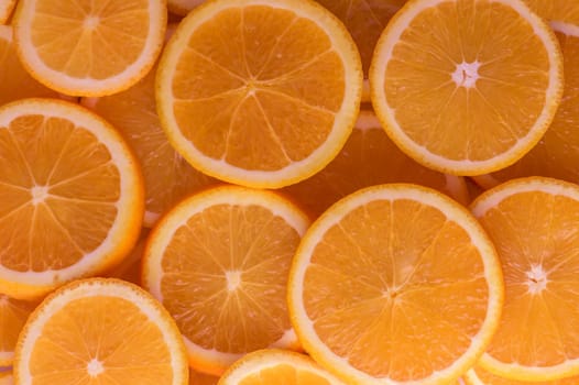 oranges cut into slices and laid out on the table as a food background 7