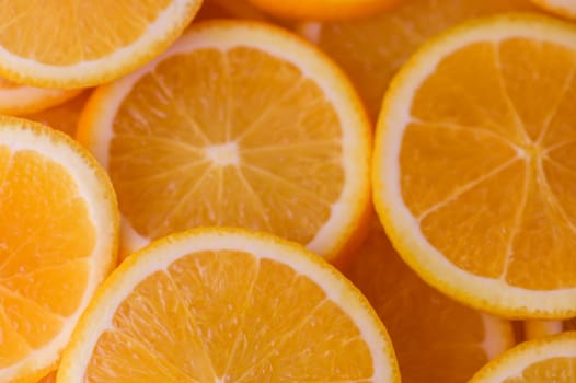 oranges cut into slices and laid out on the table as a food background 12