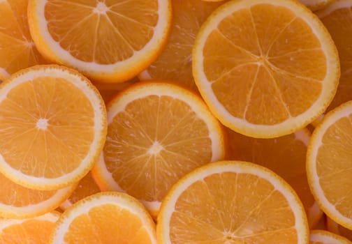 oranges cut into slices and laid out on the table as a food background 6