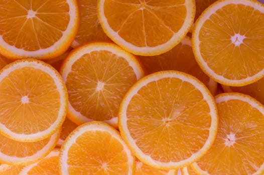 oranges cut into slices and laid out on the table as a food background 13