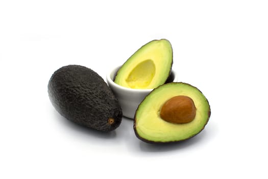 Fresh and healthy Avocado cut in half isolated