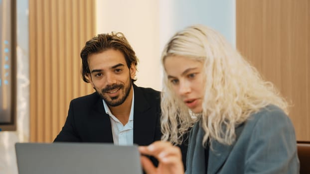 Diverse office worker employee working and brainstorm on strategic business marketing planning. Teamwork and positive attitude create productive and supportive in ornamented business office workplace.