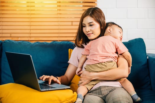 In her home office a mother works diligently on her laptop while her baby daughter sleeps. The affectionate care and responsibility she demonstrates are heartwarming.