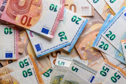 euro bills scattered on the table as a background 17