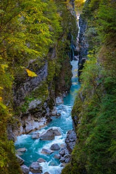 A picturesque gorge with a powerful flow of river water and mountain slopes