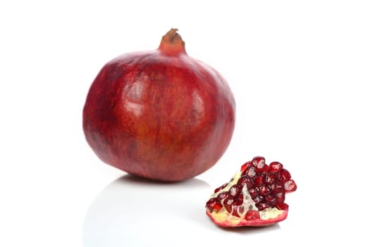 pomegranate and pomegranate slice on a white background 2
