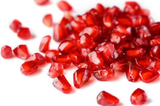 juicy pomegranate seeds on white background 1