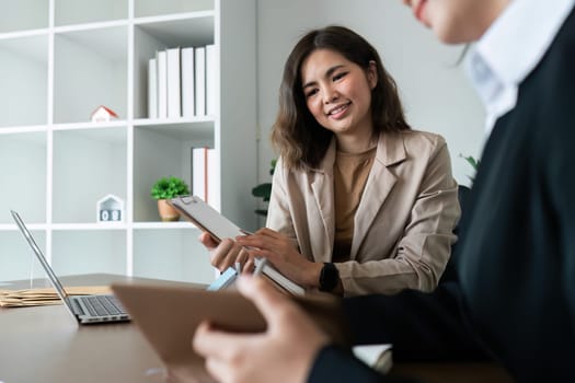 accountant with laptop and paperwork analyzing financial data report.