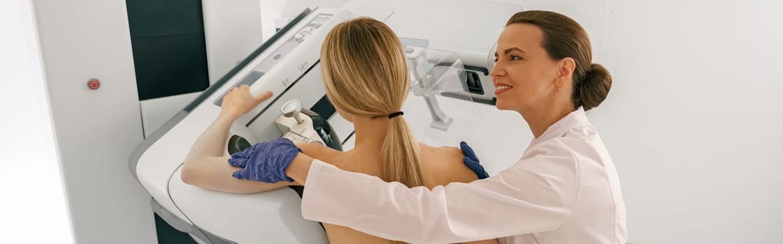 Female radiologist doing mammogram x ray for woman to check for breast cancer. High quality photo